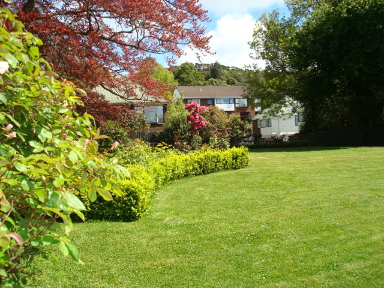 Park like grounds adjacent to apartments